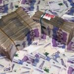 fajos y billetes de 50 mil pesos Moneda Colombiana